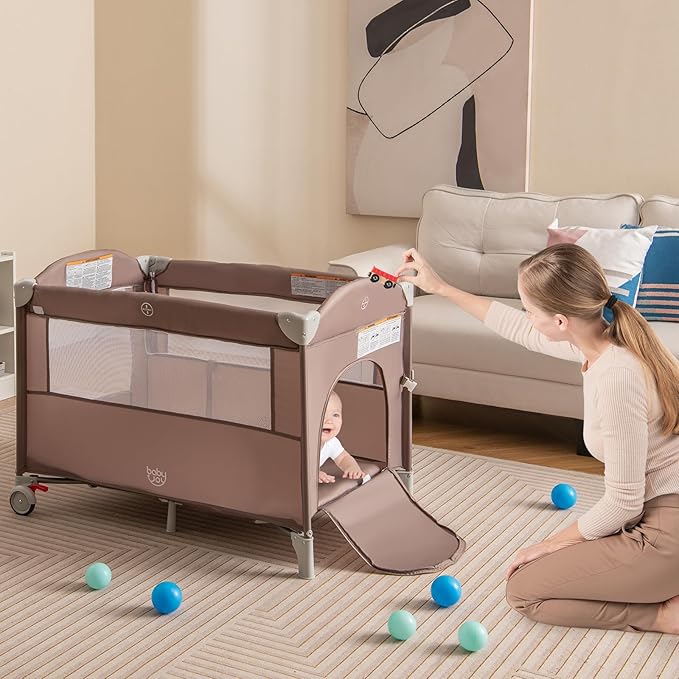 BABY JOY 5-in-1 Pack and Play, Portable Baby Bedside Sleeper with Bassinet, U-Shaped Diaper Changer, Safety Strap, Side Zipper Entrance, Bedside Crib Playard from Newborn to Toddlers (Coffee)